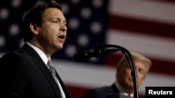 El candidato republicano a gobernador de Florida, Ron DeSantis, junto al presidente Donald Trump. (Archivo)